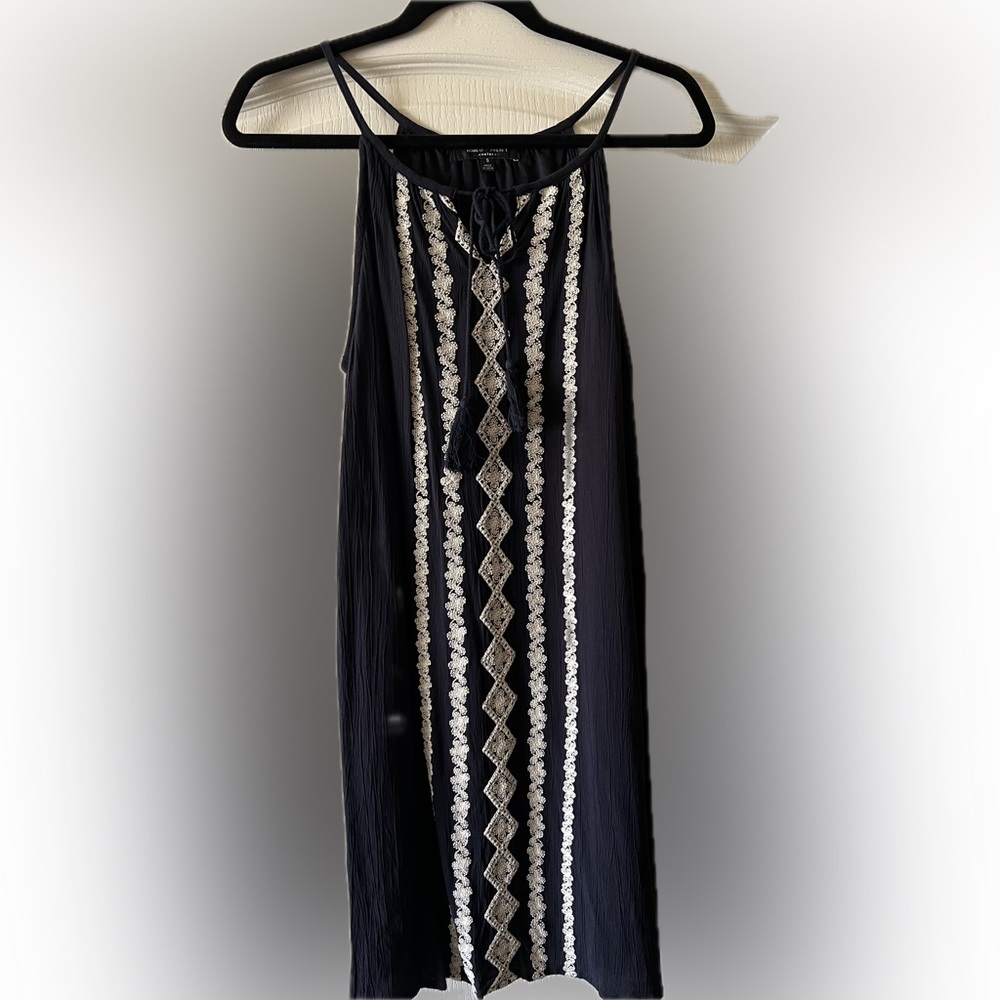 Sleeveless dress, blue with white embroidery design. 35 1/2” length.